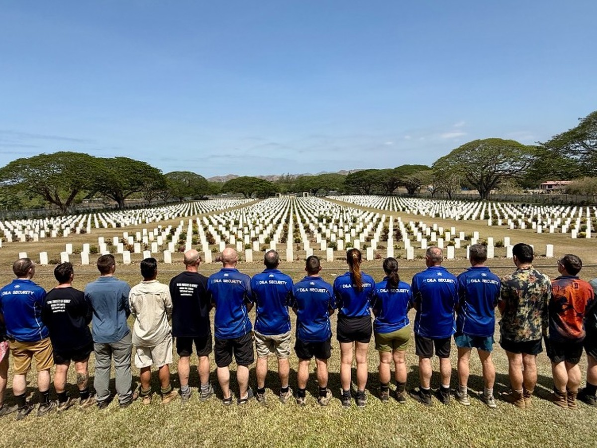 Group overlooking Bomana War Cemetery